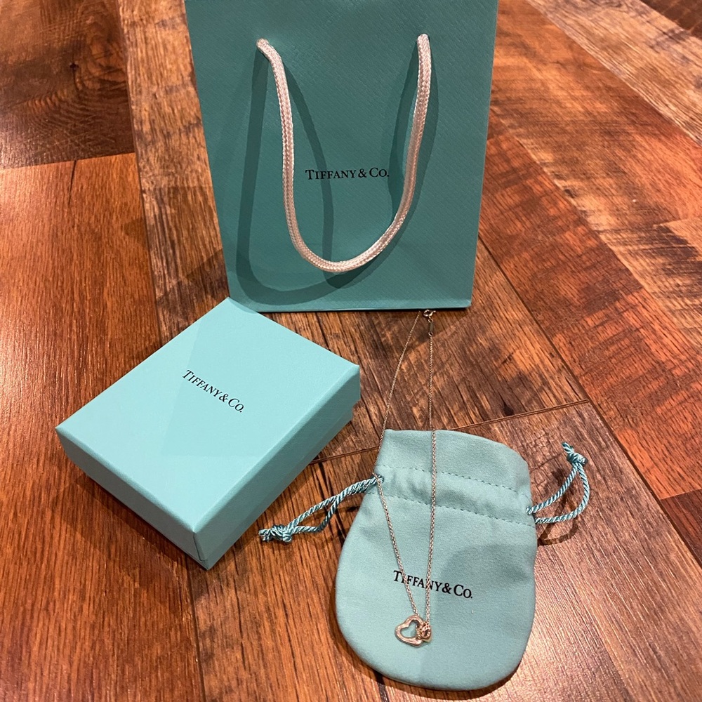 Tiffany open heart pendant necklace. Silver and rose gold hearts